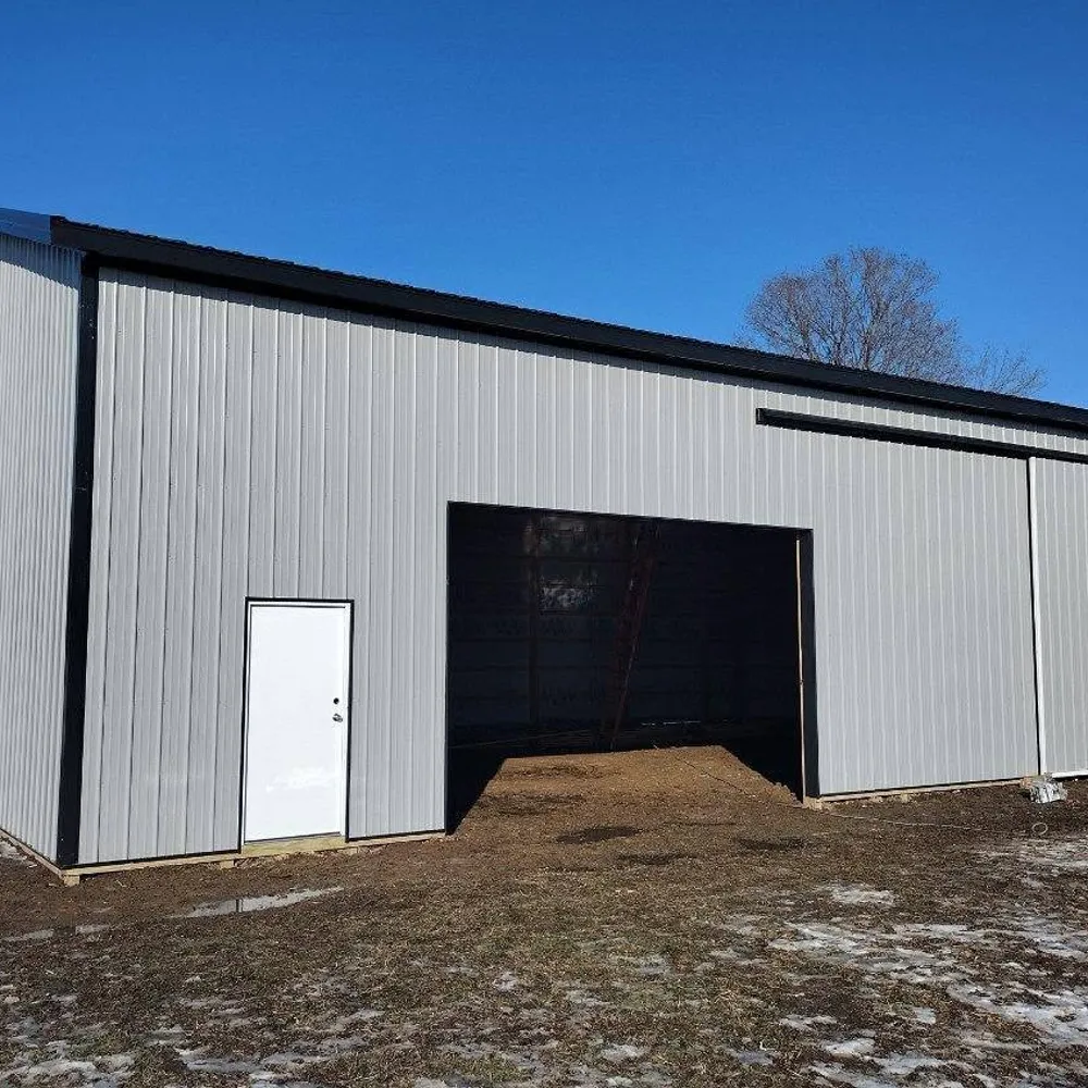 Custom residential pole barn with stone accents
